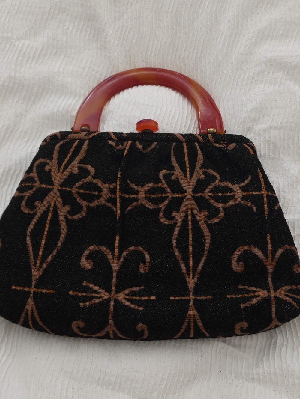 Black and Brown Patterned Wristlet Clutch with Amber Handle
